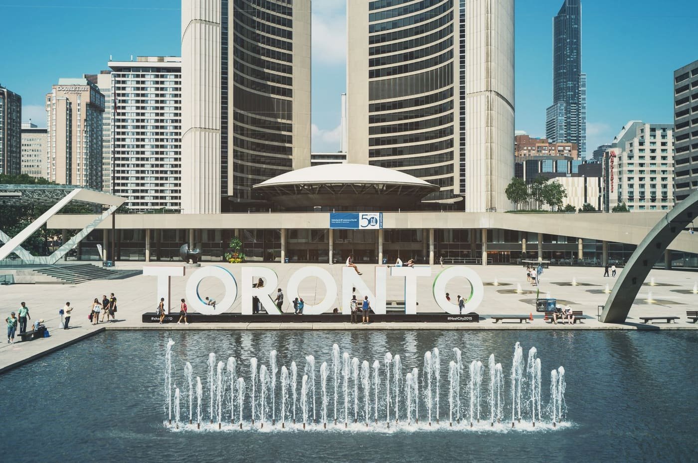 Toronto City Hall and Nathan Phillips Square with the Toronto sign and fountains
