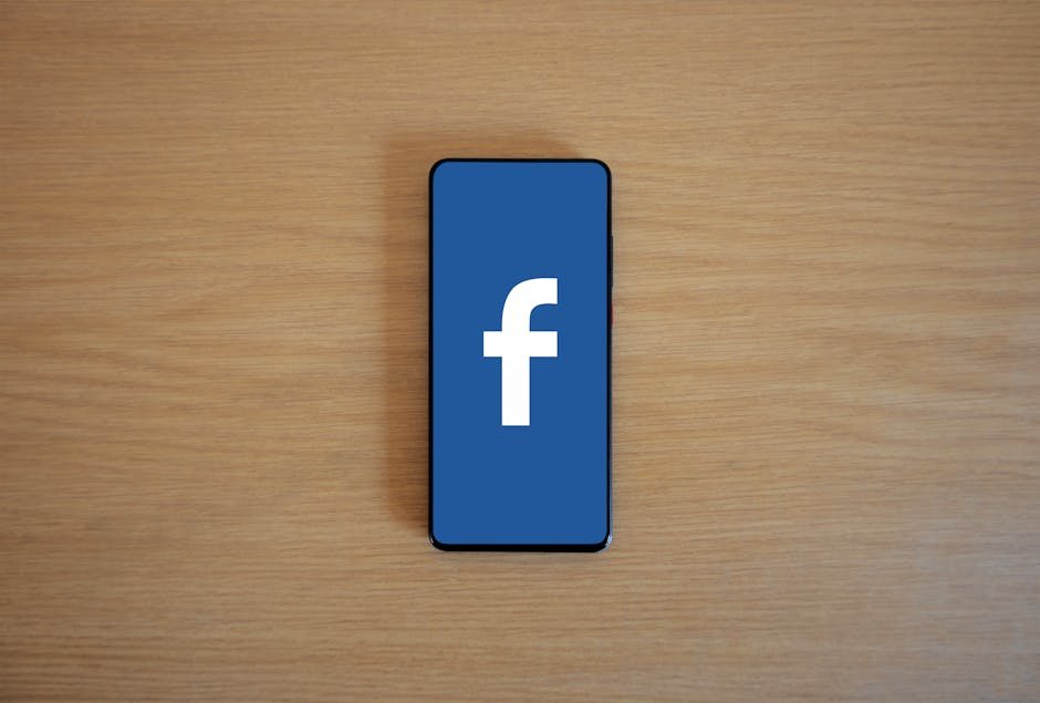 Creative reviewing Facebook and Instagram ad creative on laptop