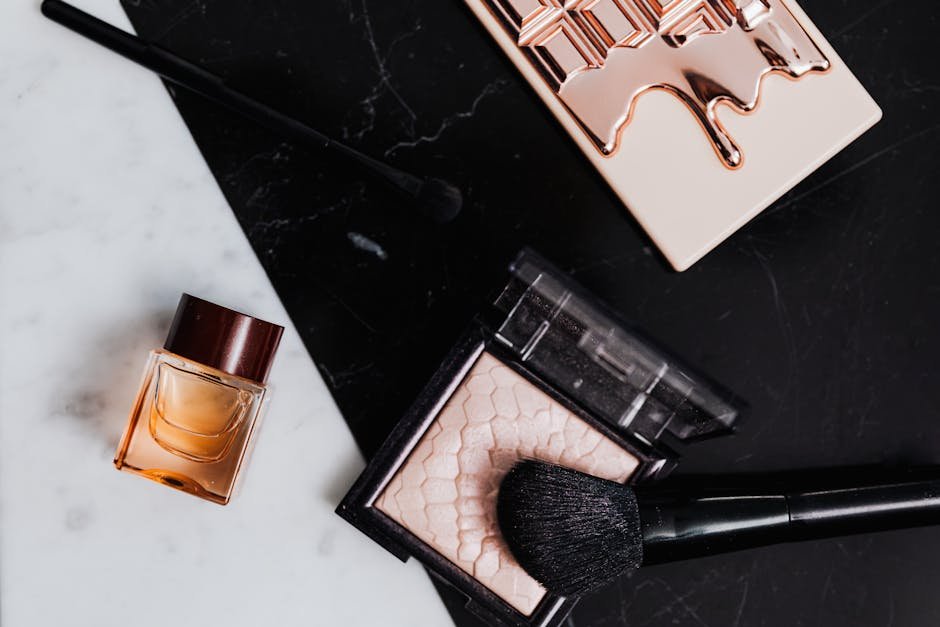 Ecommerce product photographer styling and shooting a product with seamless backdrop, tethered monitor, and precise lighting