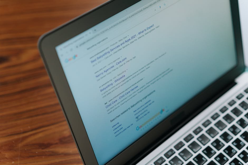 Laptop screen showing keyword research tool with search volume data